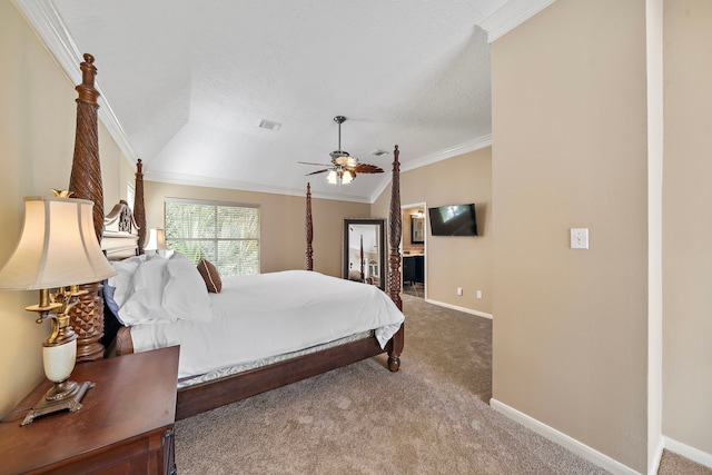 bedroom featuring ensuite bath, carpet, ceiling fan, ornamental molding, and lofted ceiling