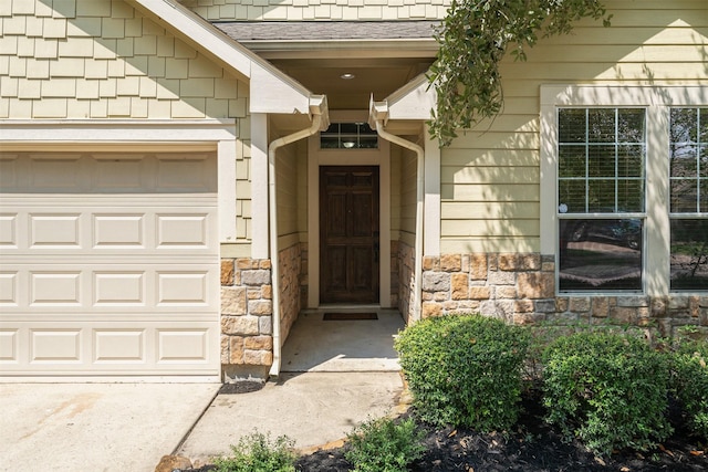 doorway to property featuring a garage