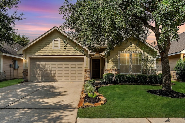 view of front of house with a lawn and a garage