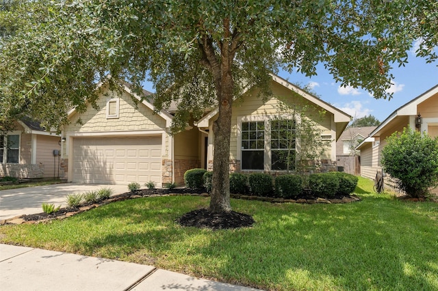 view of front of home featuring a garage and a front lawn