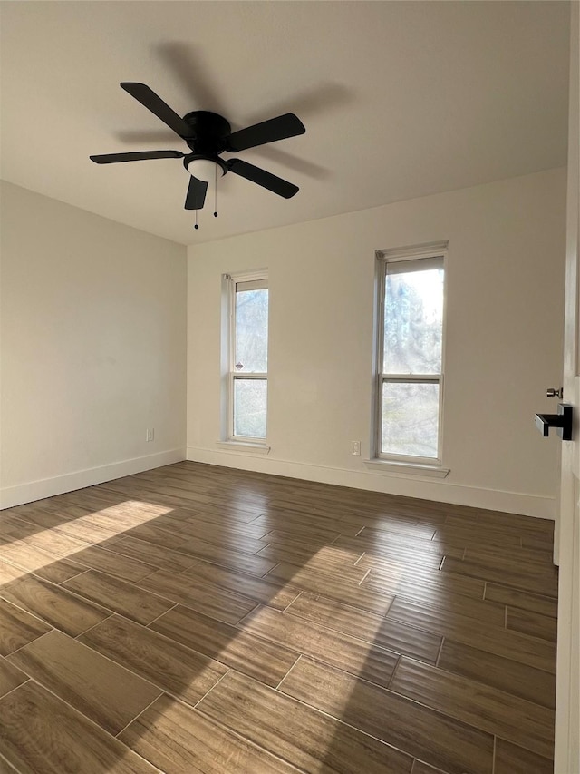 empty room featuring ceiling fan and a healthy amount of sunlight