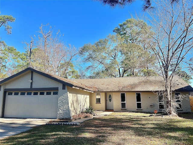 ranch-style home featuring a front lawn and a garage