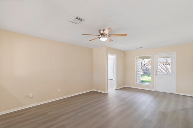 empty room featuring hardwood / wood-style flooring and ceiling fan