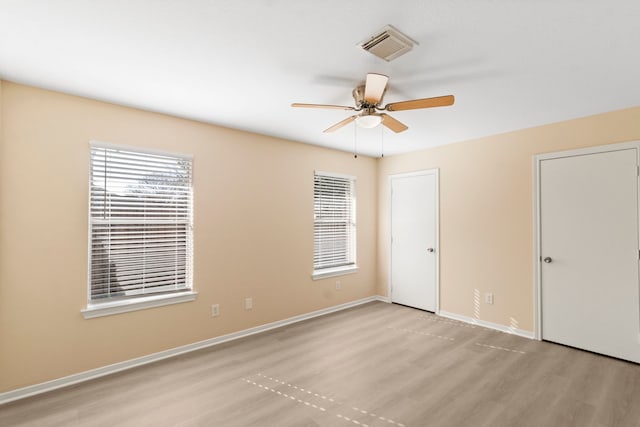 unfurnished room with ceiling fan and light hardwood / wood-style flooring