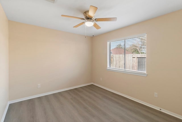 spare room featuring ceiling fan and hardwood / wood-style floors