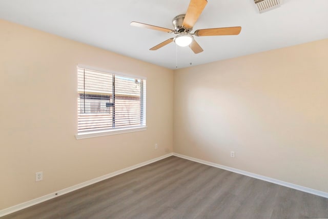 unfurnished room featuring ceiling fan and dark wood-type flooring