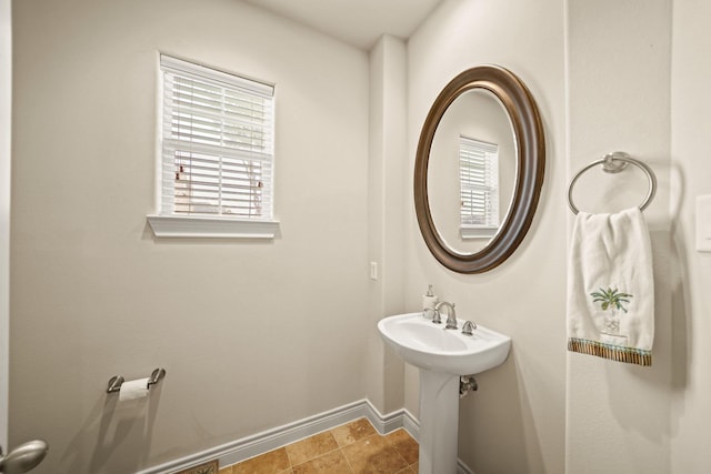 bathroom featuring sink and a wealth of natural light