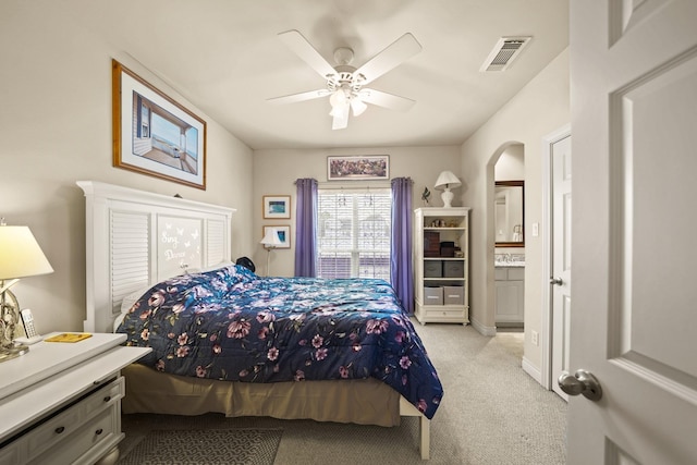 bedroom with ceiling fan and light colored carpet