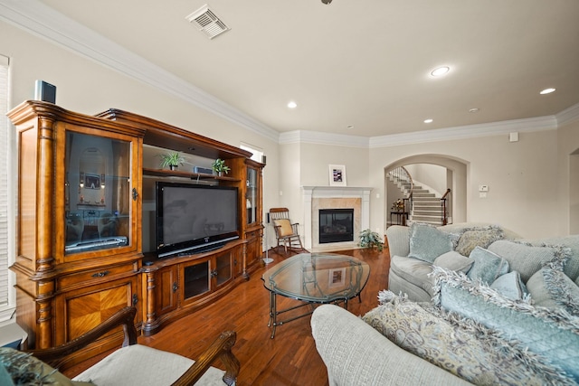 living room featuring dark hardwood / wood-style flooring and ornamental molding