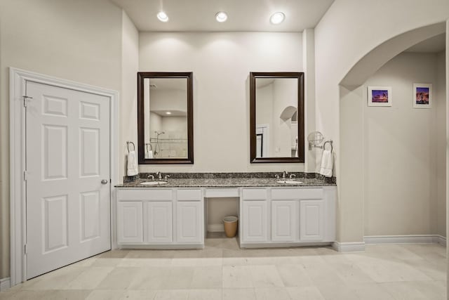 bathroom with tile patterned flooring and vanity