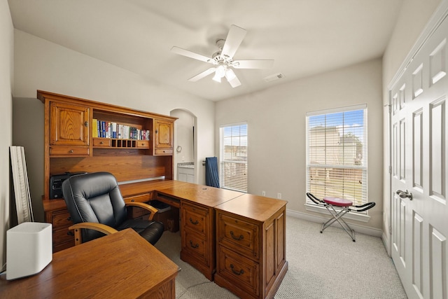 office with ceiling fan, light carpet, and plenty of natural light