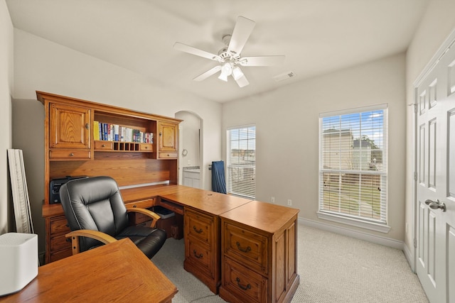 carpeted office featuring ceiling fan