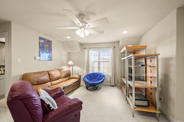 living room with light carpet and ceiling fan