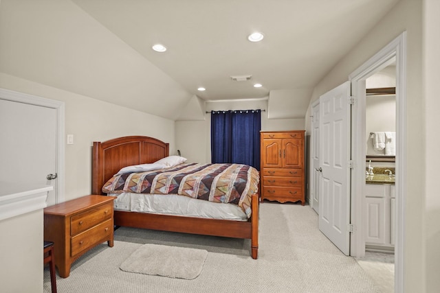 carpeted bedroom with vaulted ceiling