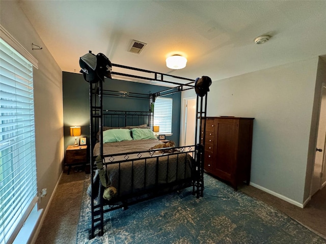 bedroom featuring visible vents, carpet floors, and baseboards