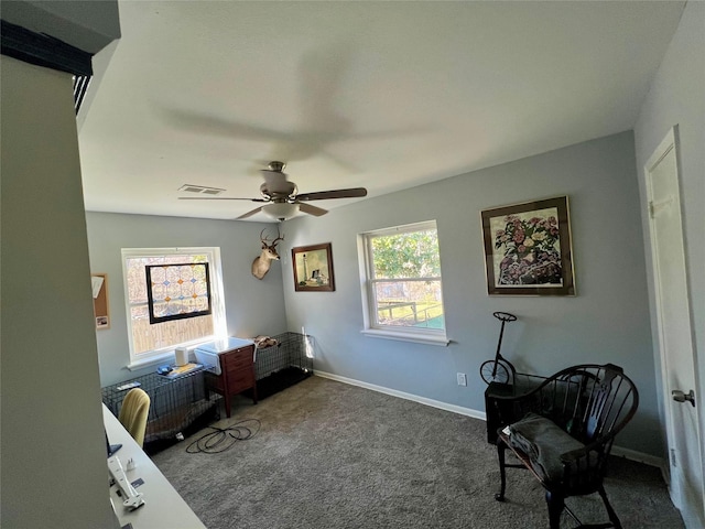 sitting room featuring visible vents, baseboards, carpet, and ceiling fan