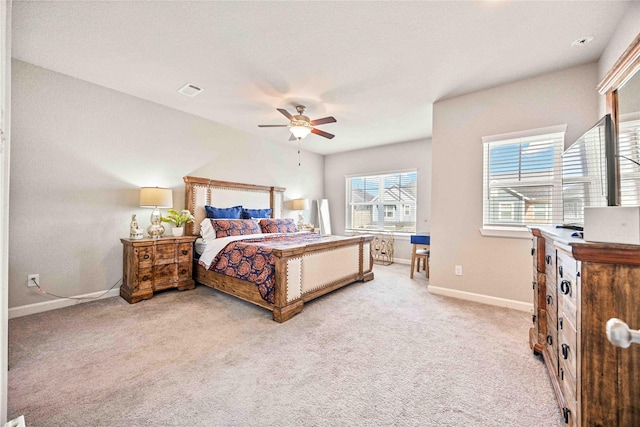 bedroom featuring ceiling fan and light carpet