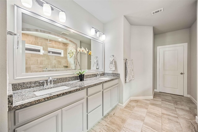 bathroom with vanity and walk in shower