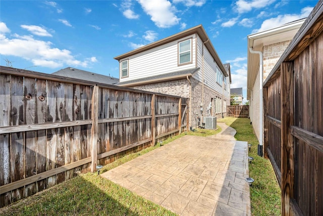 exterior space featuring cooling unit and a patio