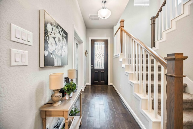 entryway with dark hardwood / wood-style floors