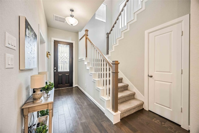 entrance foyer with dark hardwood / wood-style floors