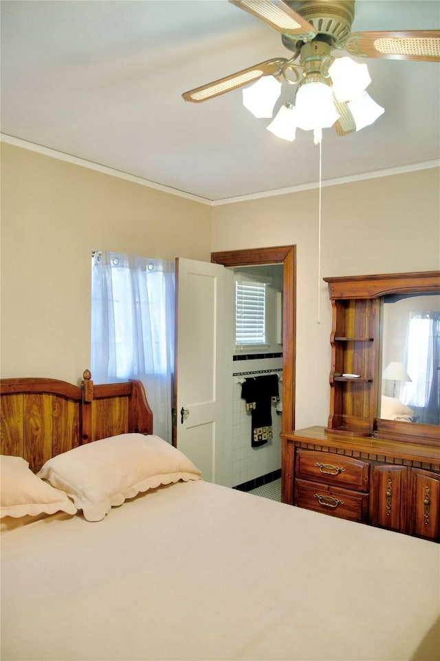 bedroom featuring ceiling fan and ornamental molding