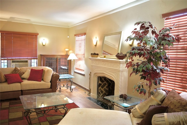 living room with cooling unit, a high end fireplace, light hardwood / wood-style floors, and crown molding