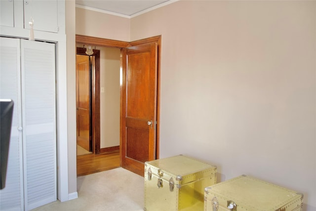 bedroom with a closet and crown molding