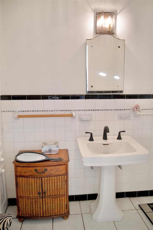 bathroom with tile patterned flooring and tile walls