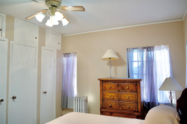 bedroom featuring radiator, ceiling fan, and ornamental molding