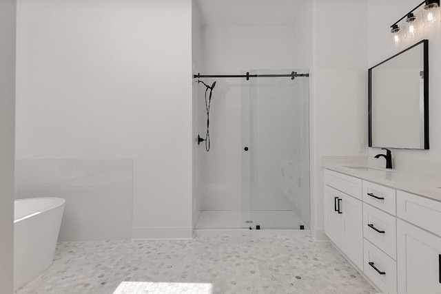 bathroom with shower with separate bathtub and vanity