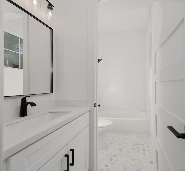 full bathroom featuring toilet, tub / shower combination, and vanity