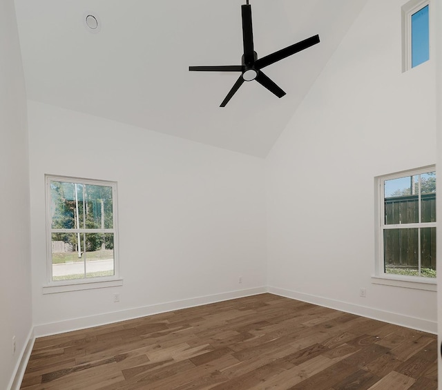 spare room featuring high vaulted ceiling, ceiling fan, and dark hardwood / wood-style floors