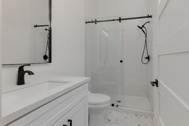 bathroom with toilet, walk in shower, and vanity