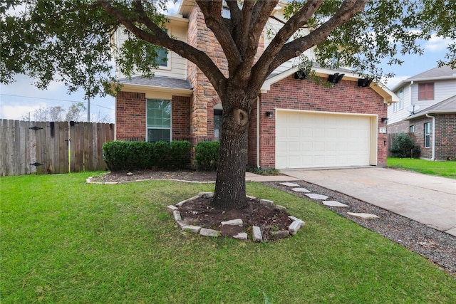 view of front facade with a garage and a front lawn