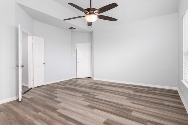 empty room with wood-type flooring and ceiling fan