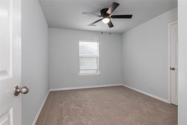 unfurnished room featuring ceiling fan and light colored carpet