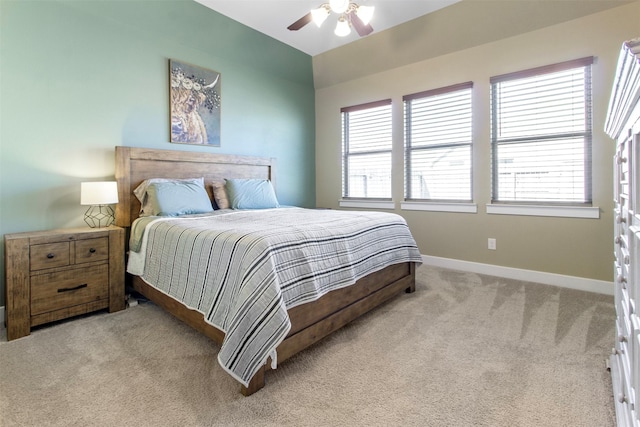 bedroom featuring light carpet and ceiling fan