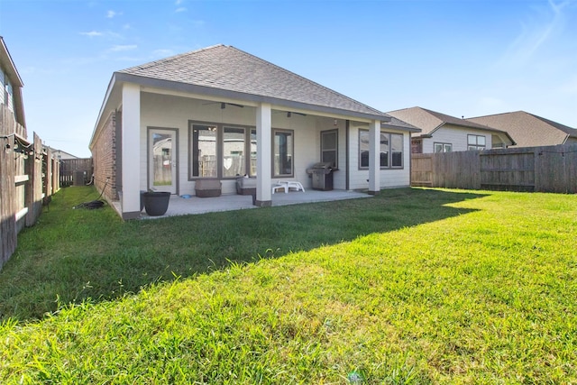 back of property featuring a patio and a lawn