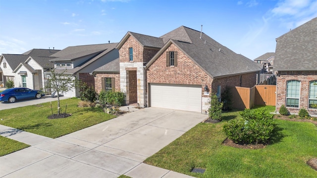 view of front of property with a front yard and a garage