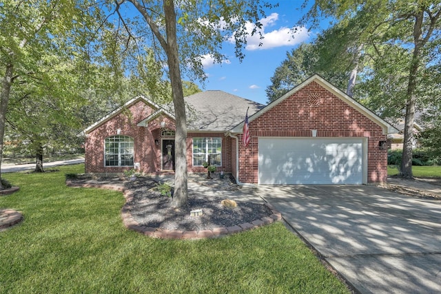 view of front of house with a front yard and a garage