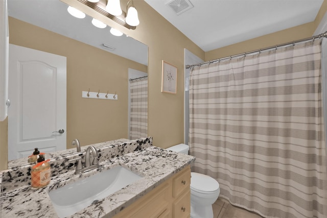 bathroom featuring a shower with curtain, tile patterned flooring, vanity, and toilet