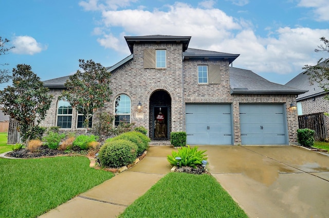 view of front facade featuring a front lawn and a garage