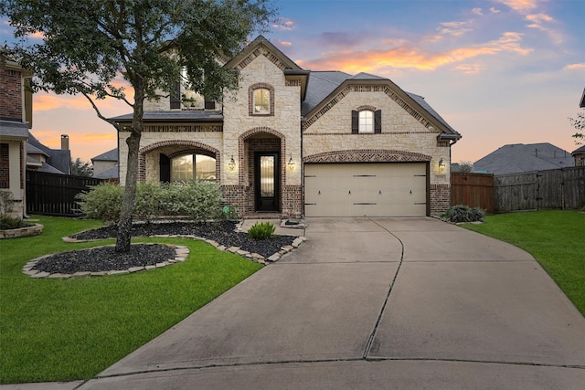 french country style house with a lawn