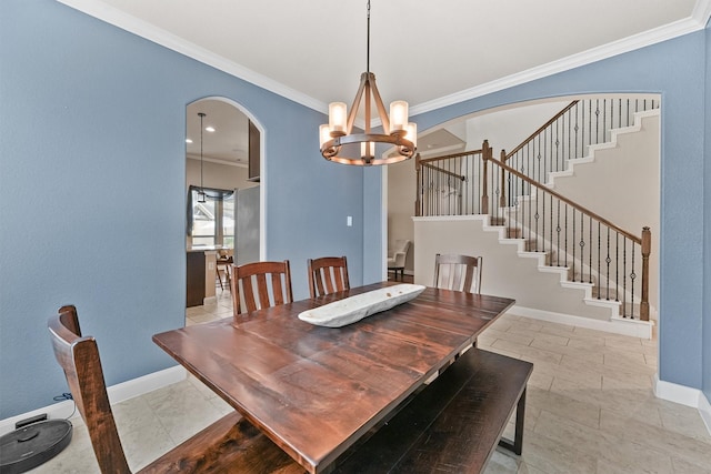 dining area featuring an inviting chandelier and crown molding