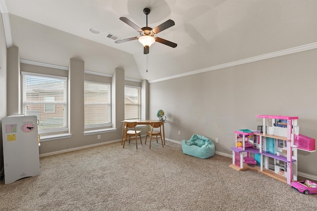 recreation room featuring lofted ceiling, ceiling fan, crown molding, and carpet flooring