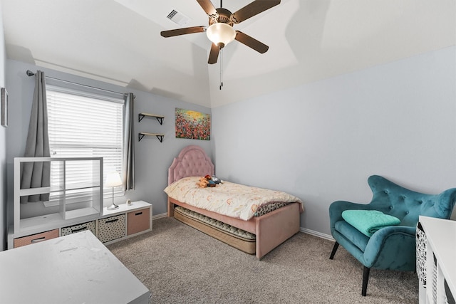 bedroom with lofted ceiling, ceiling fan, light carpet, and multiple windows