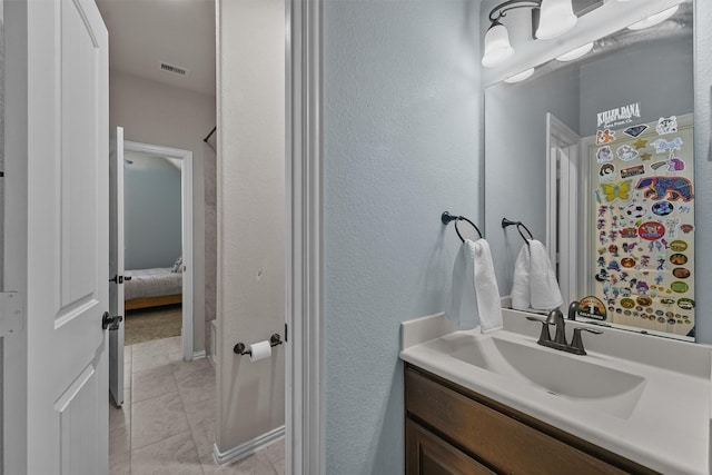 bathroom with vanity and tile patterned flooring