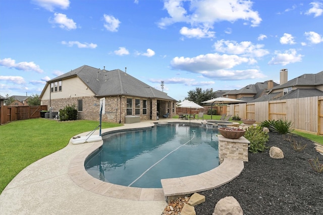 view of pool with a patio, an in ground hot tub, and a lawn