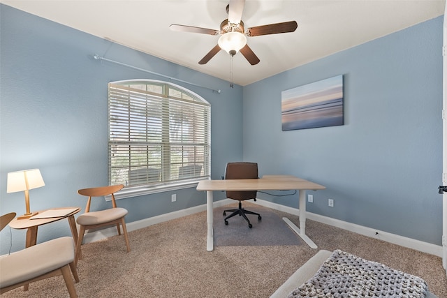 home office featuring ceiling fan and carpet